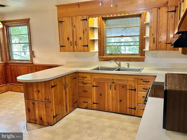 a bathroom with a sink a mirror and a bathtub