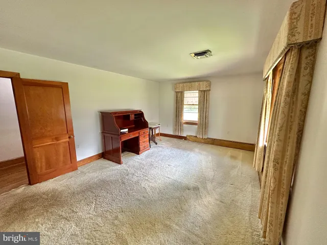 a view of a room with an entryway