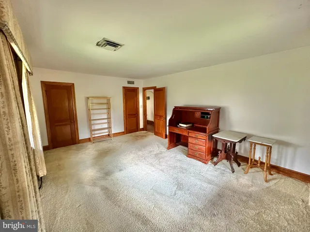 a livingroom with furniture and windows