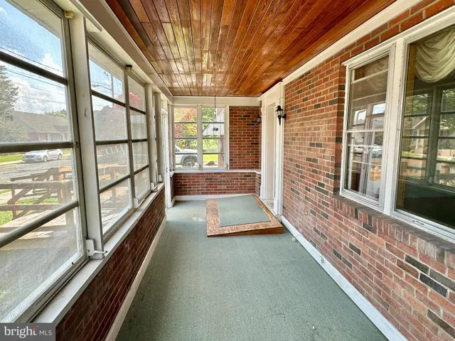 a view of a balcony with wooden floor
