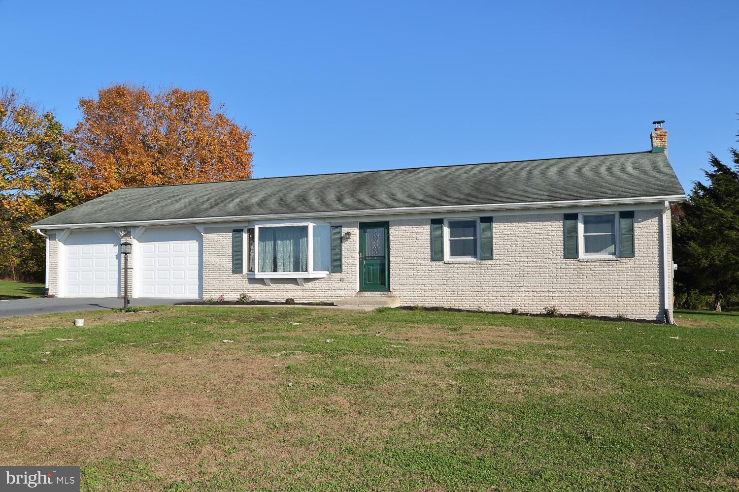1007 East Meadow Road Manheim, PA 17545 - Photo 1 of 28 a front view of a house with a garden