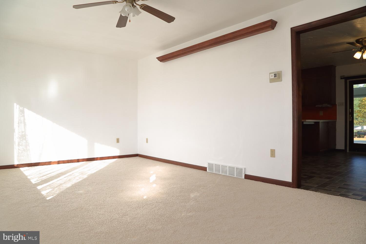1007 East Meadow Road Manheim, PA 17545 - Photo 13 of 28 an empty room with wooden floor and windows
