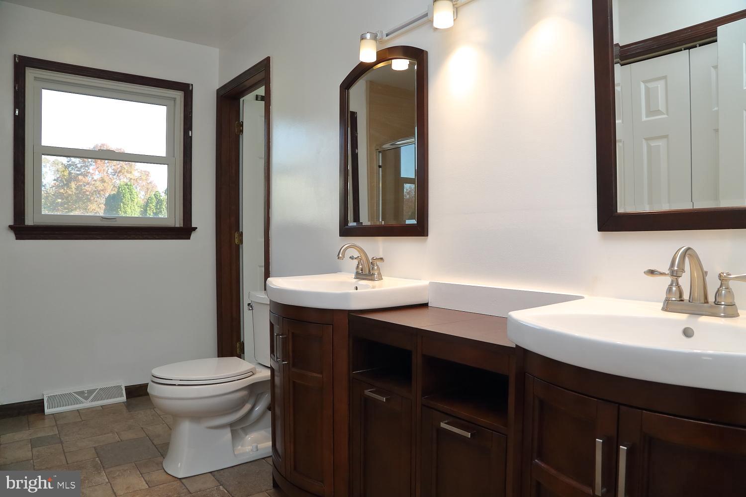 1007 East Meadow Road Manheim, PA 17545 - Photo 15 of 28 a bathroom with a toilet sink and mirror
