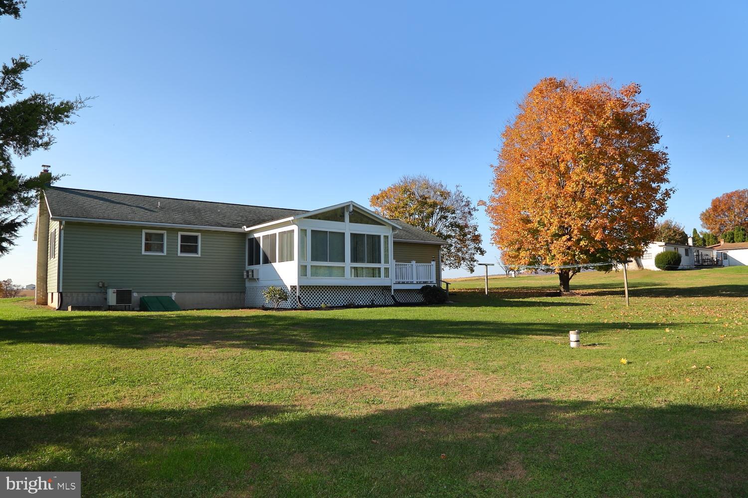 1007 East Meadow Road Manheim, PA 17545 - Photo 3 of 28 a front view of a house with a yard