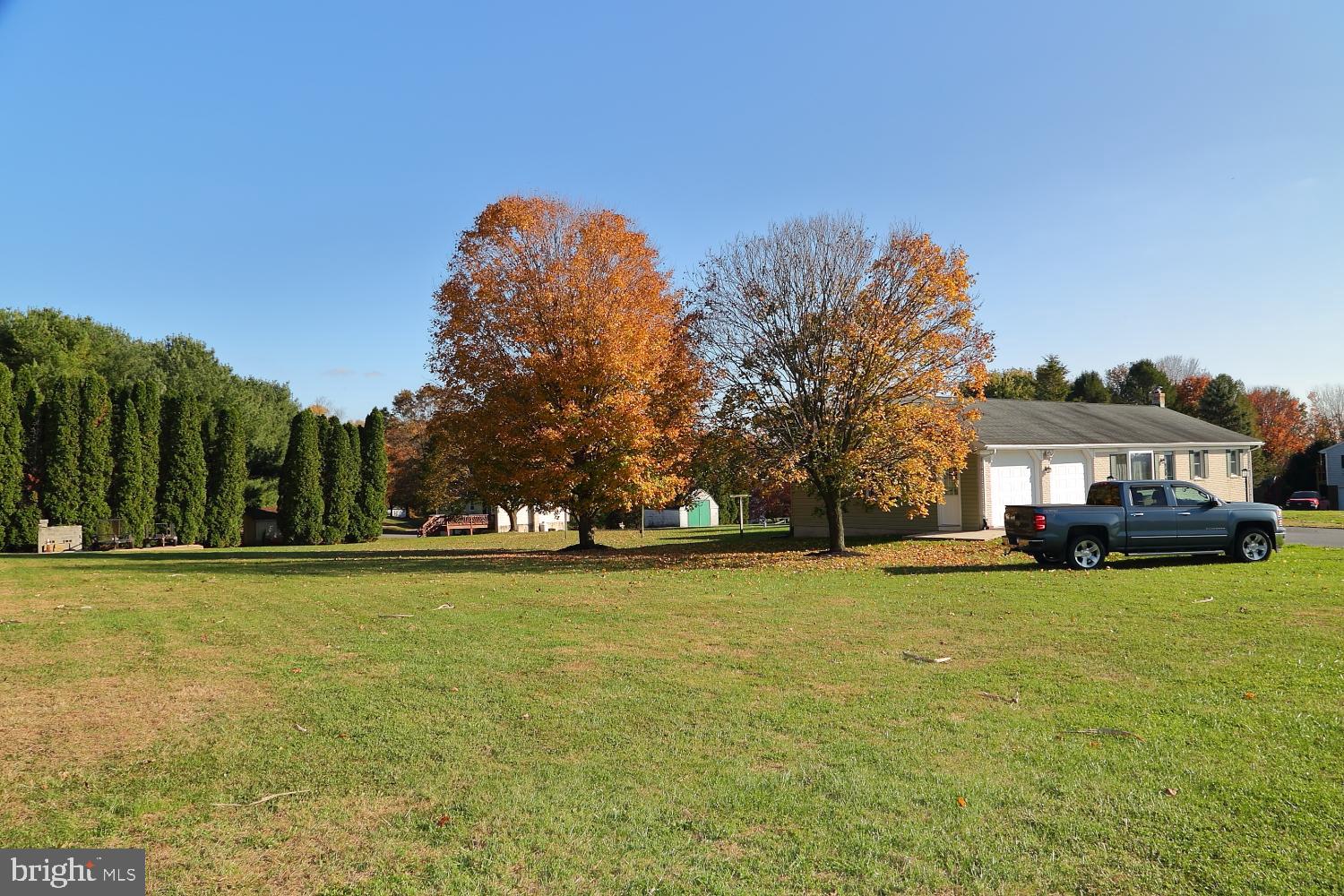 1007 East Meadow Road Manheim, PA 17545 - Photo 5 of 28 a view of a big yard with a house in the background