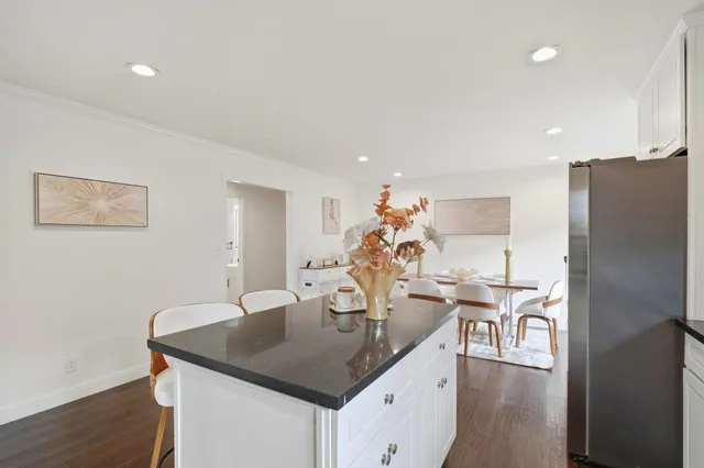 a kitchen with a table and chairs