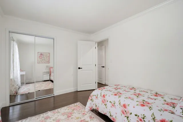 a bedroom with a bed and with the view of bathroom