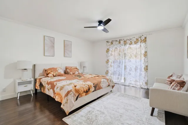 a bedroom with a bed and a couch