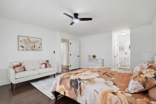 a bedroom with a bed and a couch