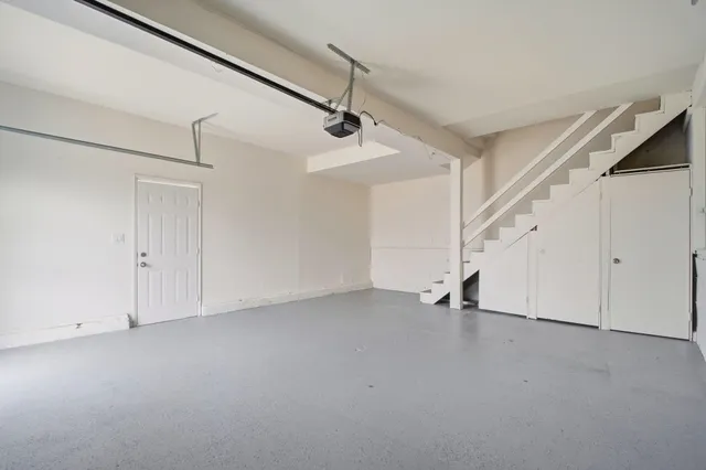 a view of an empty room with stairs