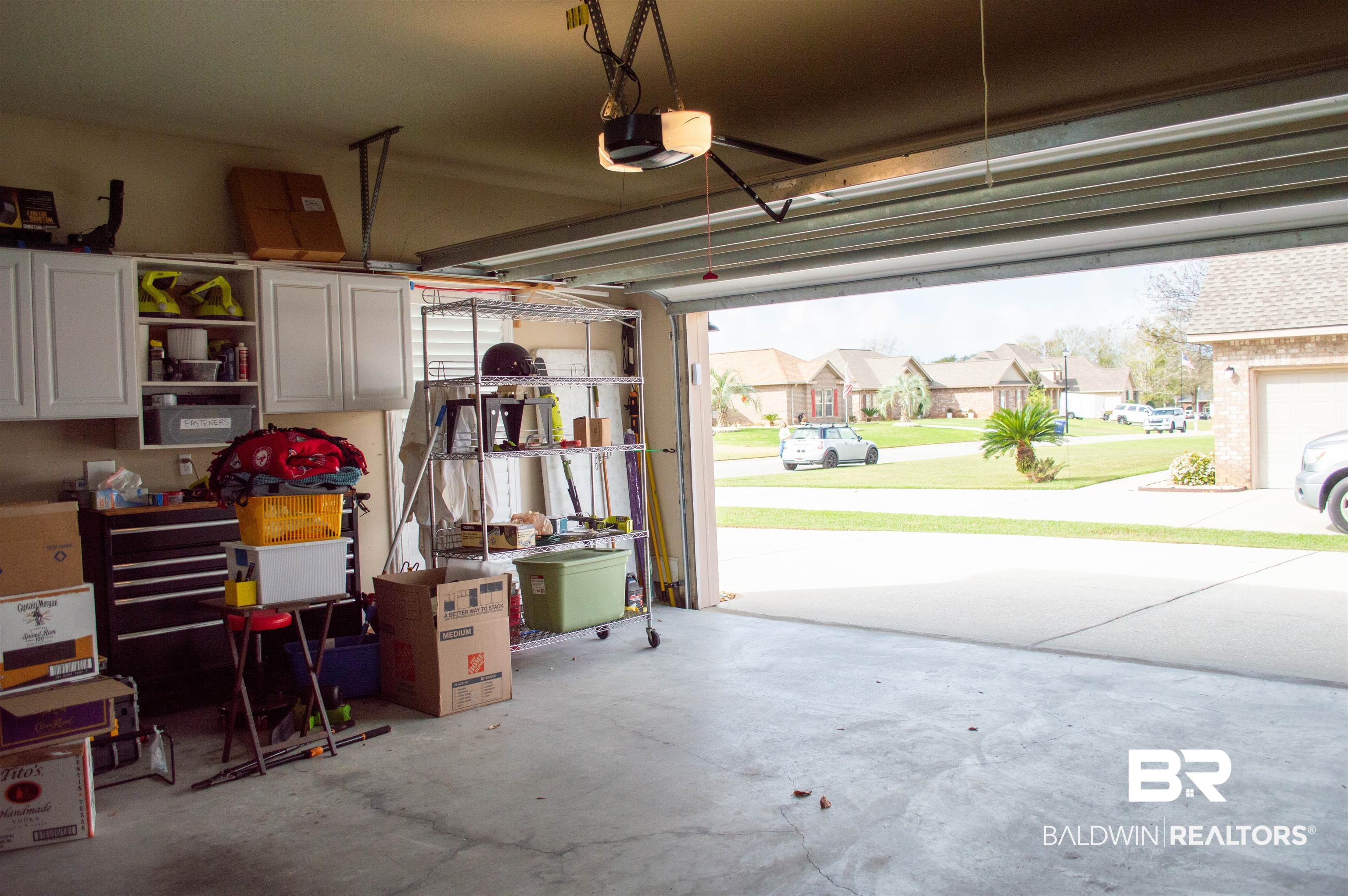 1124 West Orlando Drive Foley, AL 36535 - Photo 41 of 51 Garage with a residential view and a garage door opener
