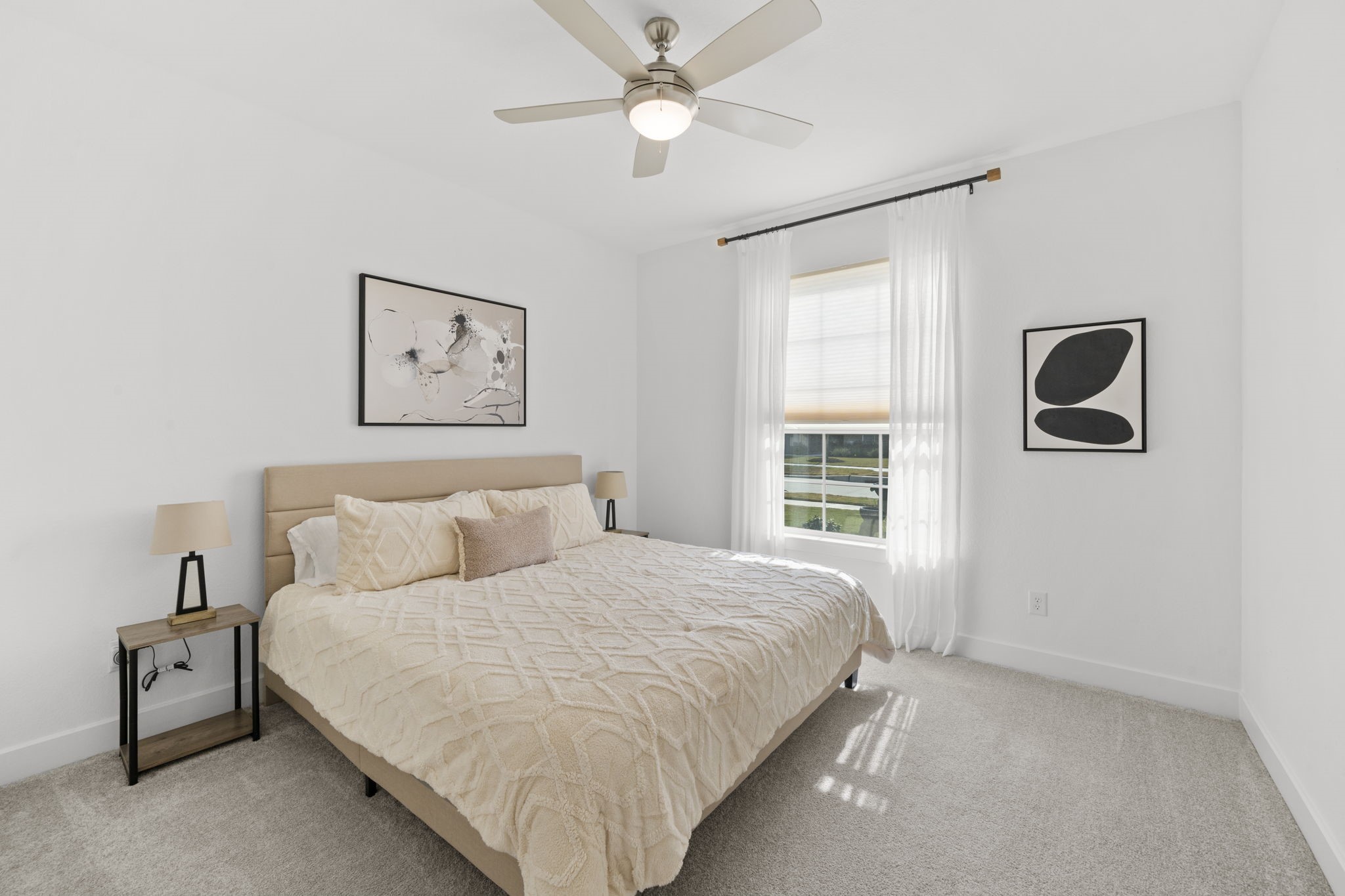 29154 Rustic Orch Lane Fulshear, TX 77441 - Photo 13 of 35 a bedroom with a large bed and a chandelier