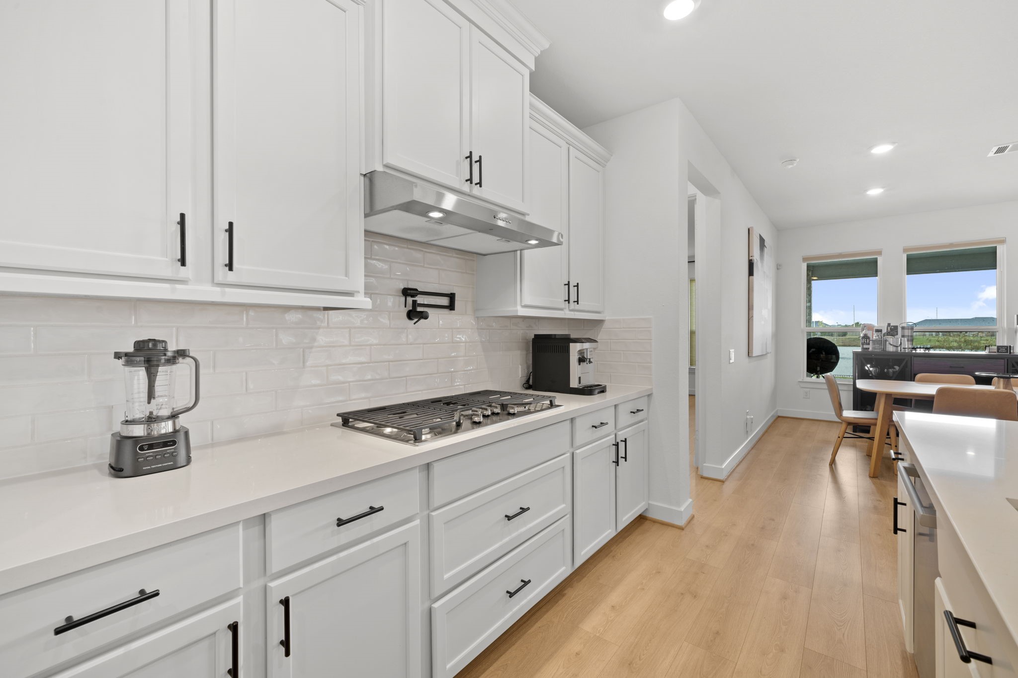 29154 Rustic Orch Lane Fulshear, TX 77441 - Photo 22 of 35 a kitchen with stainless steel appliances granite countertop a sink stove and cabinets
