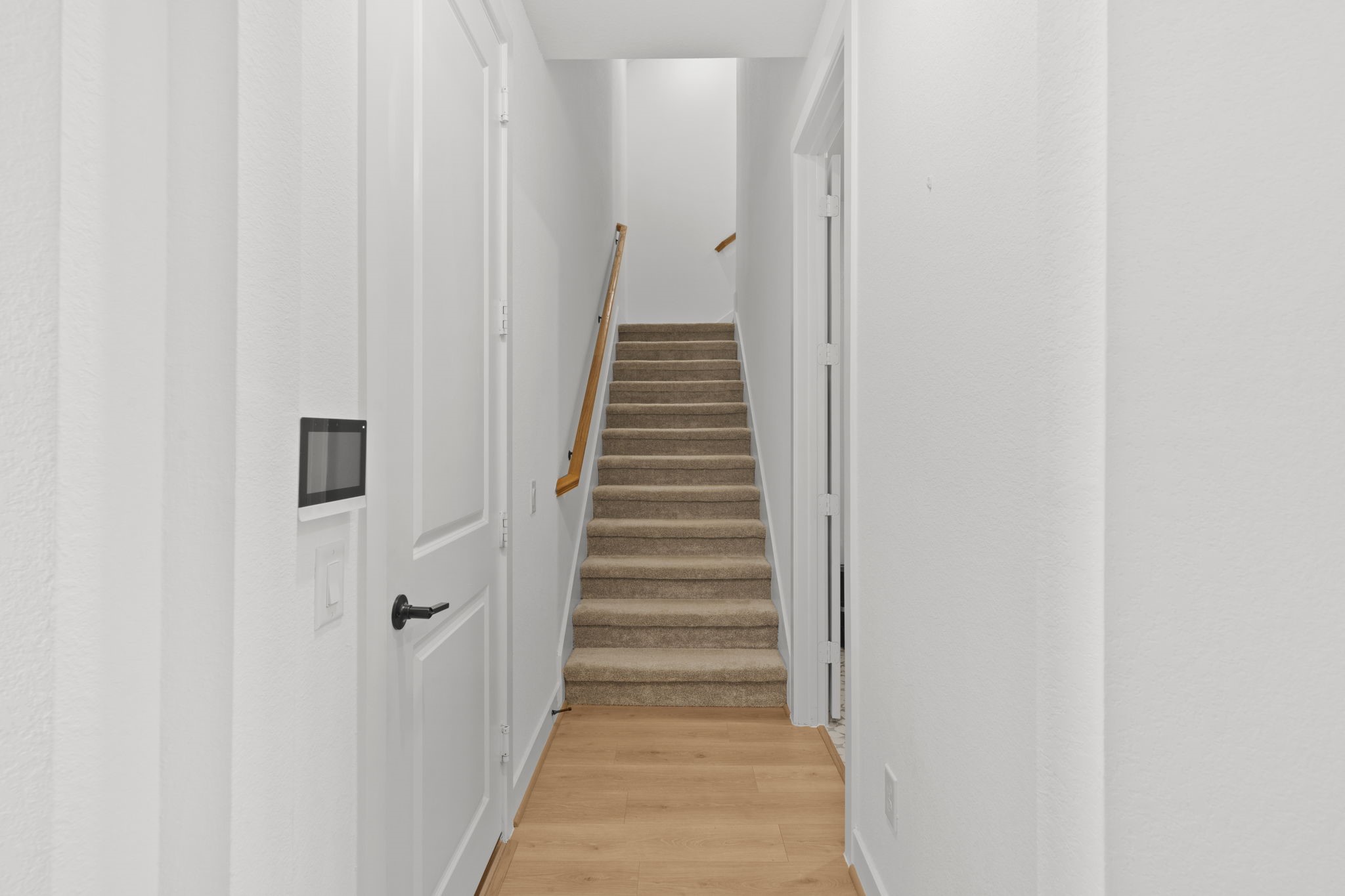 29154 Rustic Orch Lane Fulshear, TX 77441 - Photo 24 of 35 a view of a hallway with wooden floor and entryway