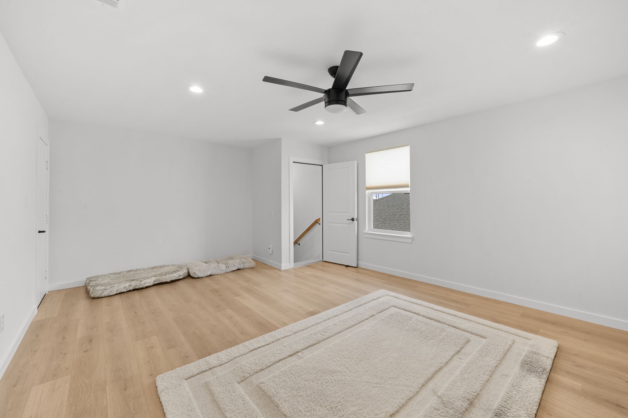 29154 Rustic Orch Lane Fulshear, TX 77441 - Photo 27 of 35 a bedroom with a bed and a ceiling fan