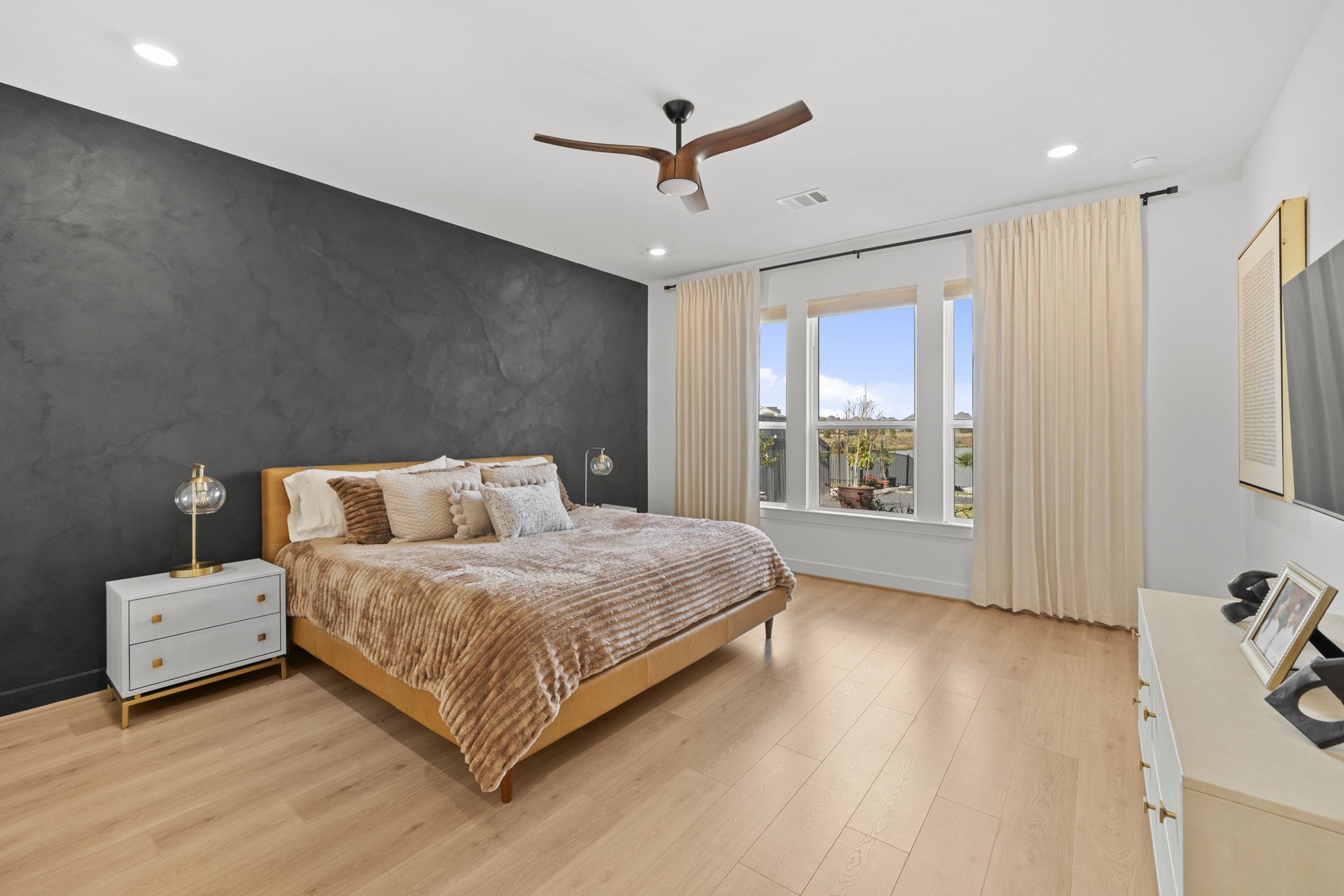 29154 Rustic Orch Lane Fulshear, TX 77441 - Photo 28 of 35 a bedroom with a large bed and a large window