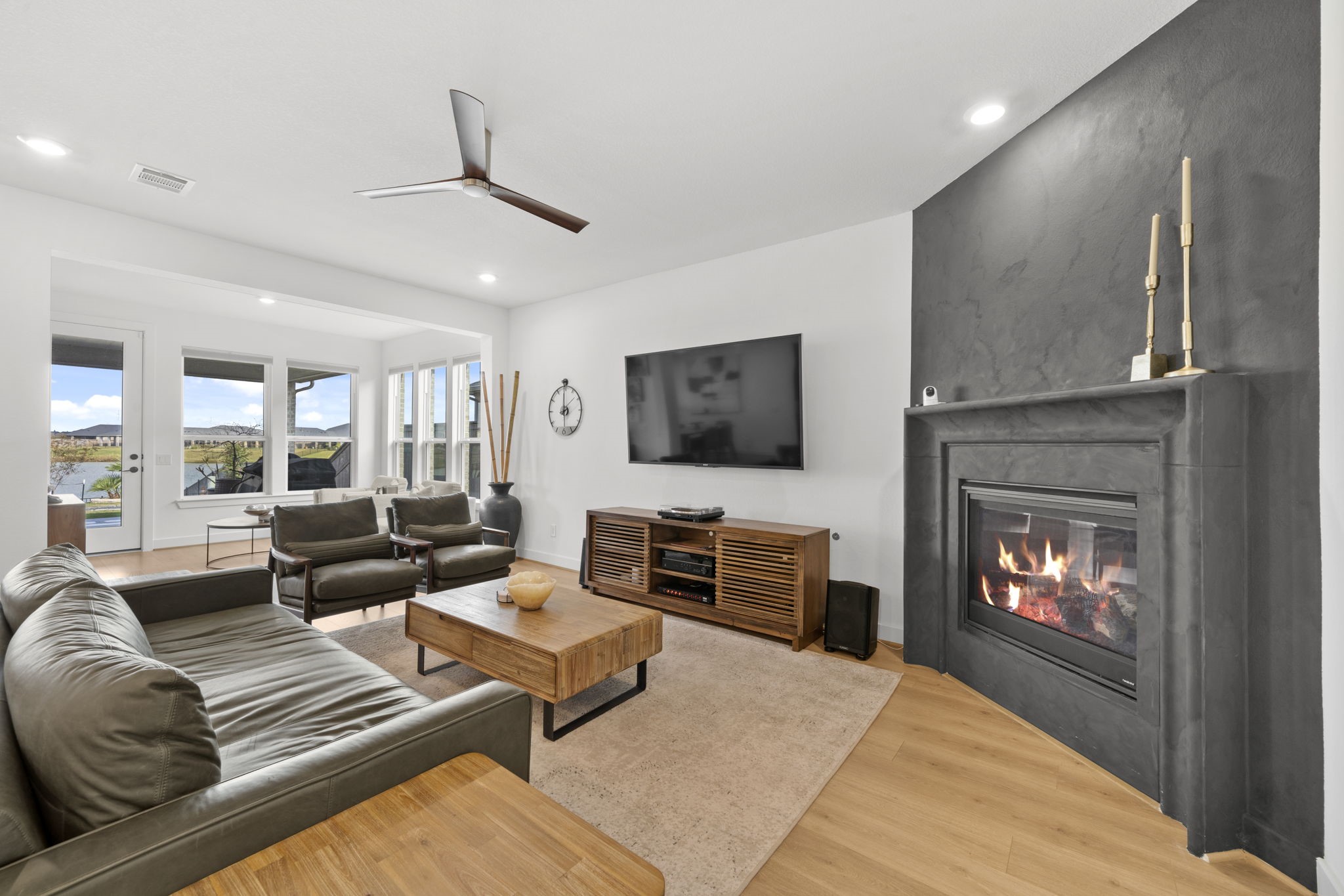 29154 Rustic Orch Lane Fulshear, TX 77441 - Photo 3 of 35 a living room with furniture and a fireplace
