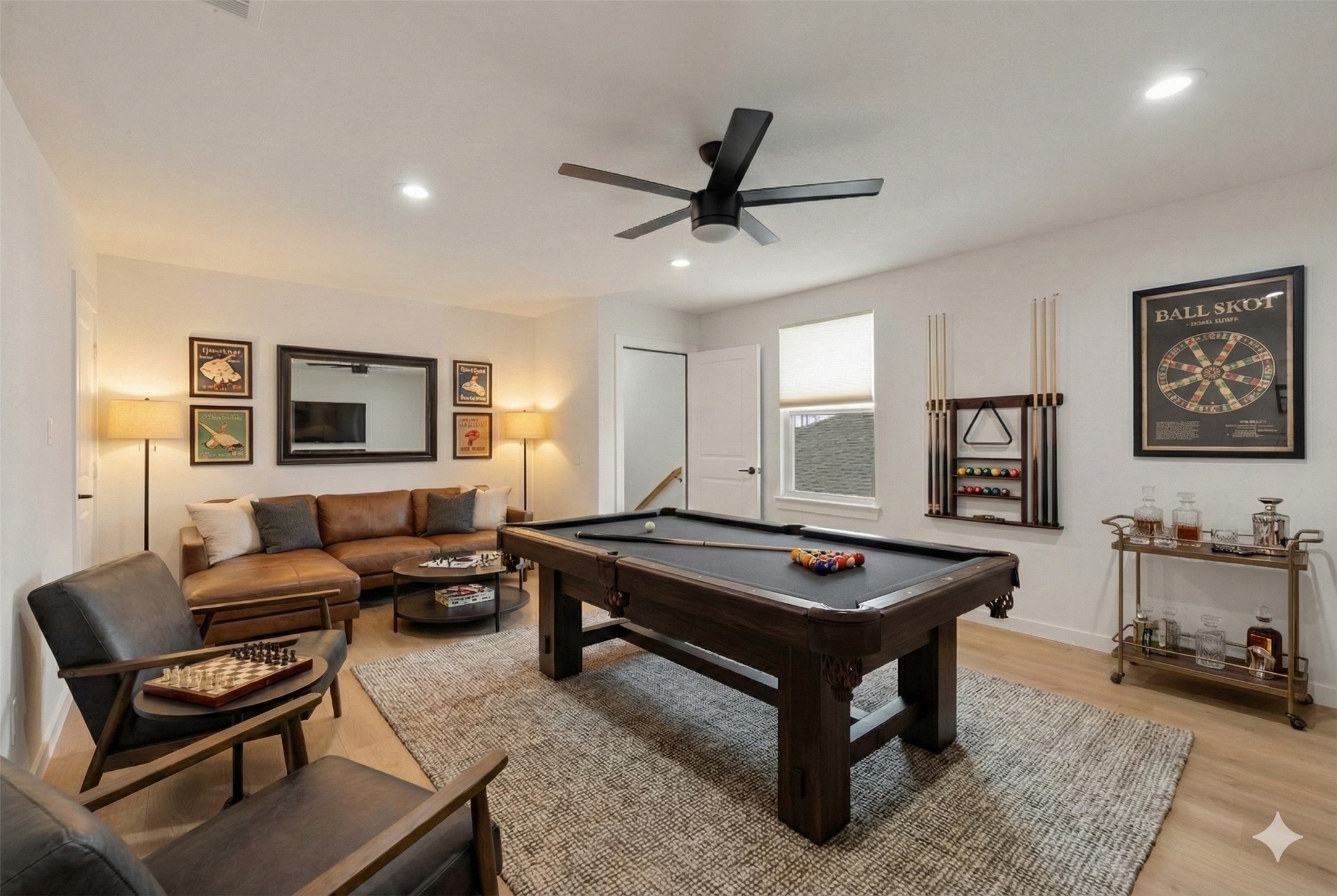 29154 Rustic Orch Lane Fulshear, TX 77441 - Photo 6 of 35 a living room with furniture a rug and a window