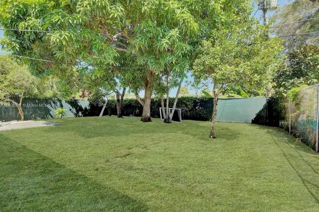 a view of backyard with green space