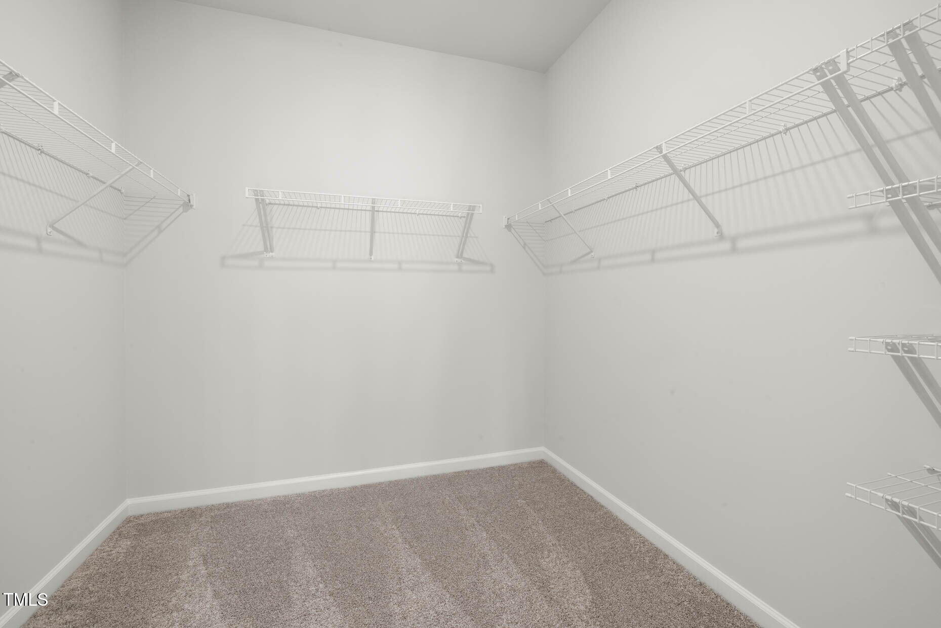 781 Denburn Place Raleigh, NC 27603 - Photo 15 of 23 a view of a room with racks on the wall