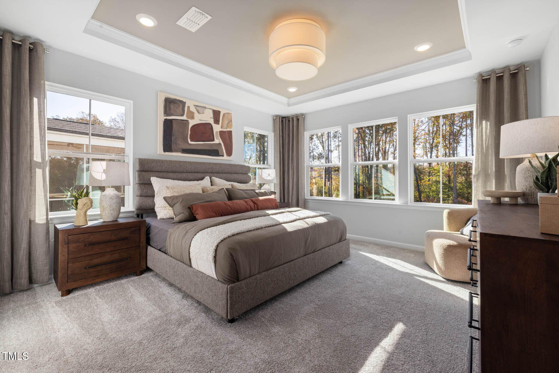 781 Denburn Place Raleigh, NC 27603 - Photo 9 of 23 a spacious bedroom with a large bed and a large window