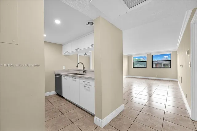 a kitchen with stainless steel appliances granite countertop a sink and a stove top oven