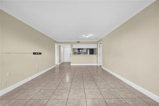 a view of an empty room with a window