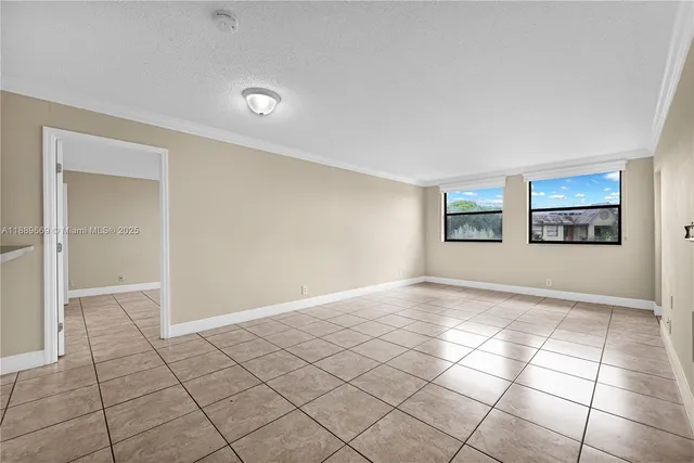 a view of an empty room and window