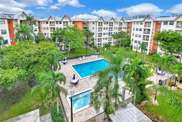 a view of a swimming pool with a patio