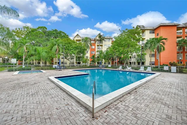 a view of a swimming pool with a patio