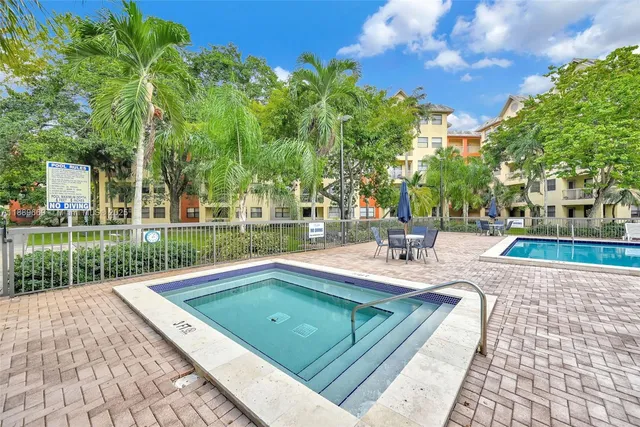 a view of a building with a swimming pool