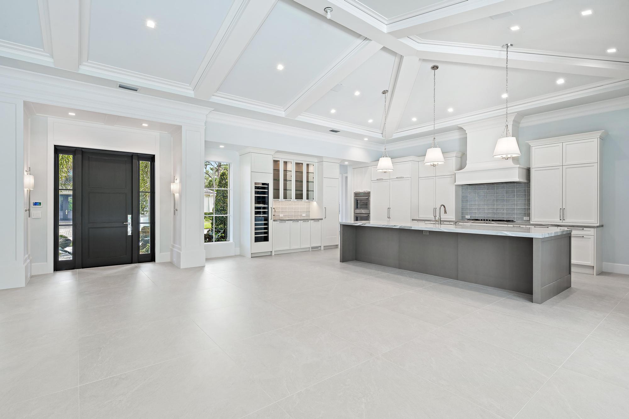 2914 Bluewater Cove Gulf Stream, FL 33483 - Photo 12 of 45 a large room with a large window and stainless steel appliances