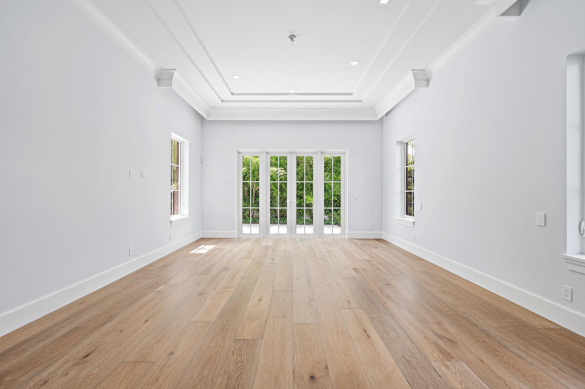 2914 Bluewater Cove Gulf Stream, FL 33483 - Photo 22 of 45 wooden floor in an empty room with a window