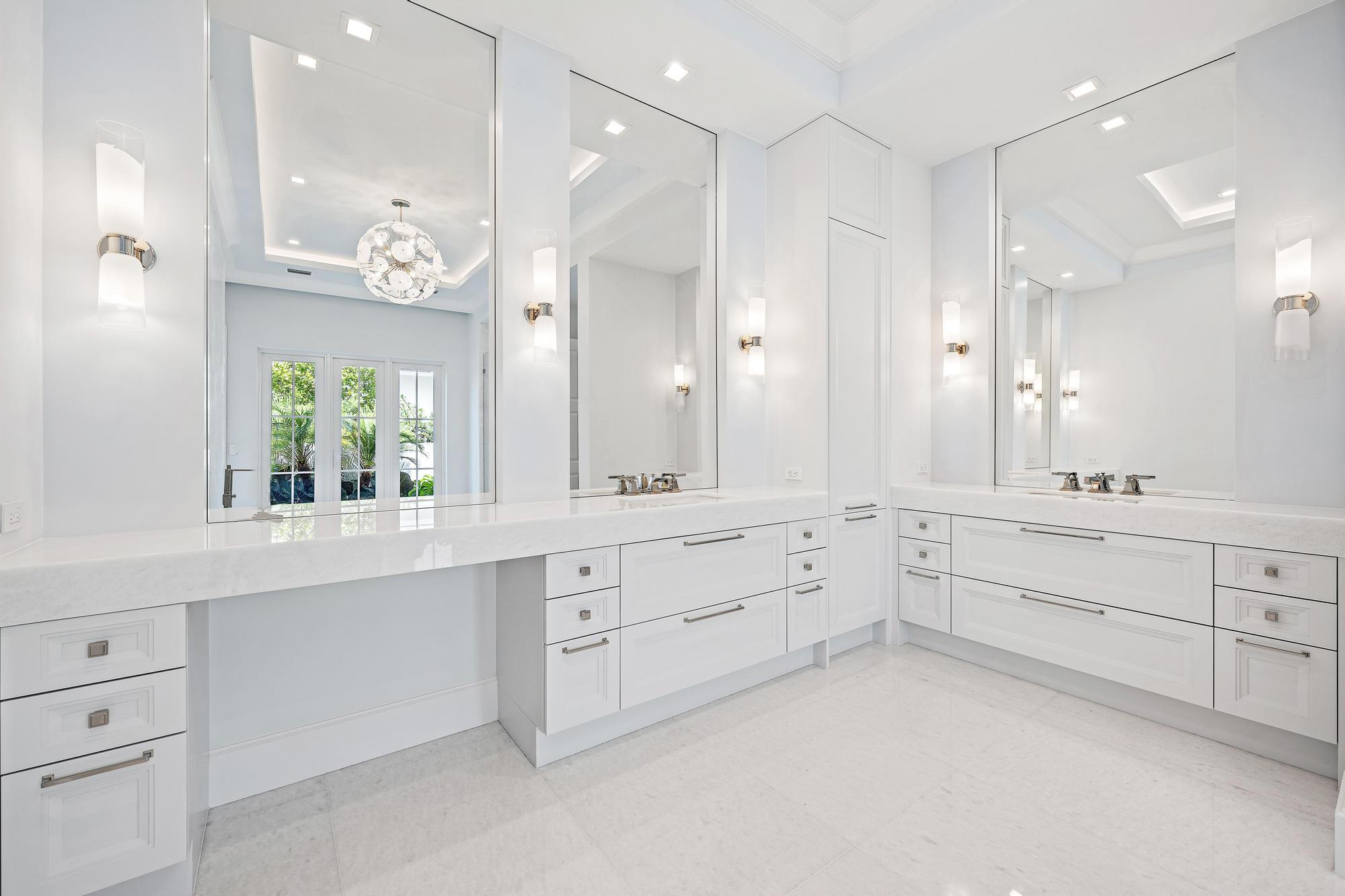 2914 Bluewater Cove Gulf Stream, FL 33483 - Photo 24 of 45 a large white kitchen with a white cabinets