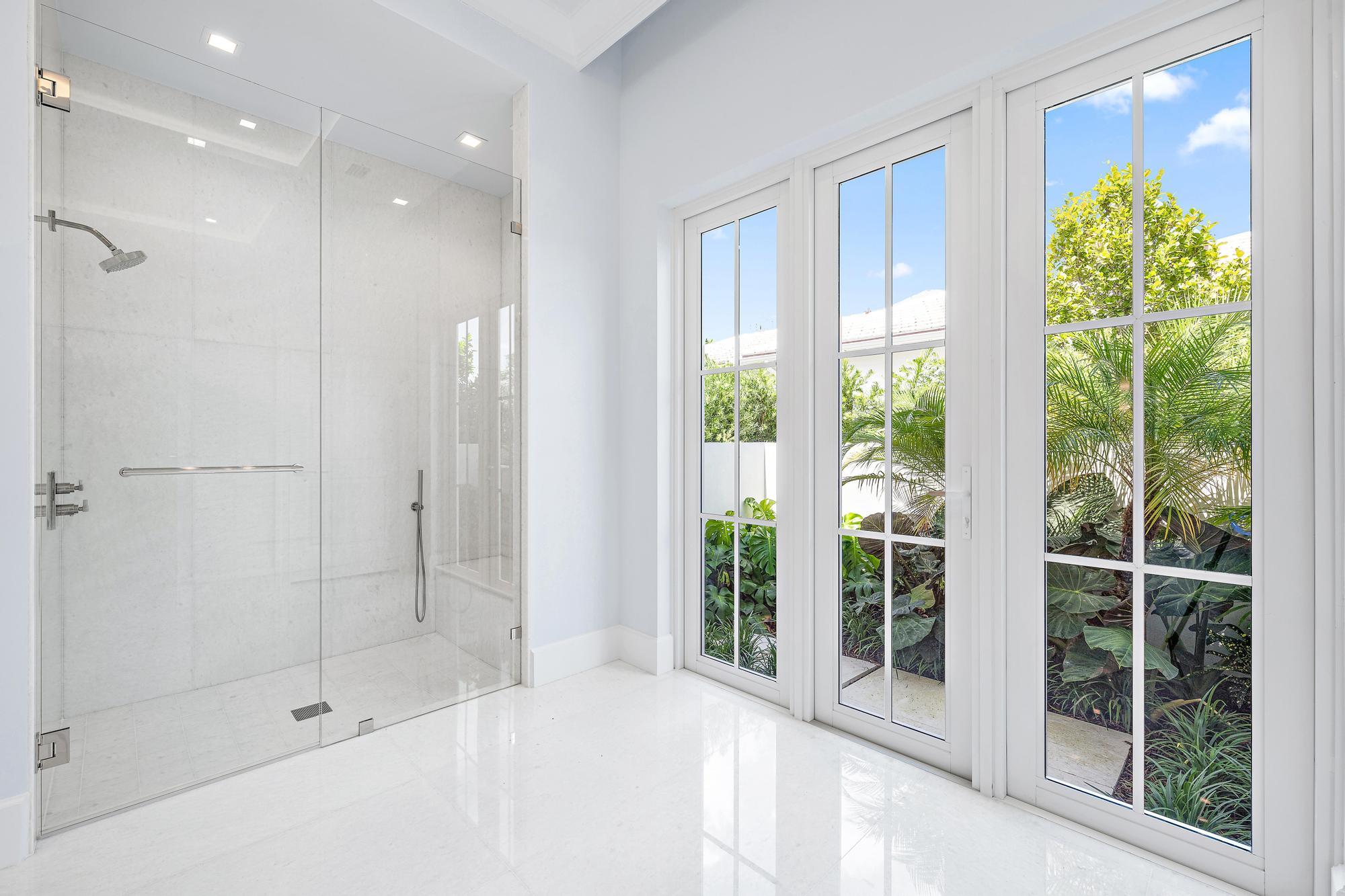 2914 Bluewater Cove Gulf Stream, FL 33483 - Photo 26 of 45 a bathroom with a shower and a bathtub