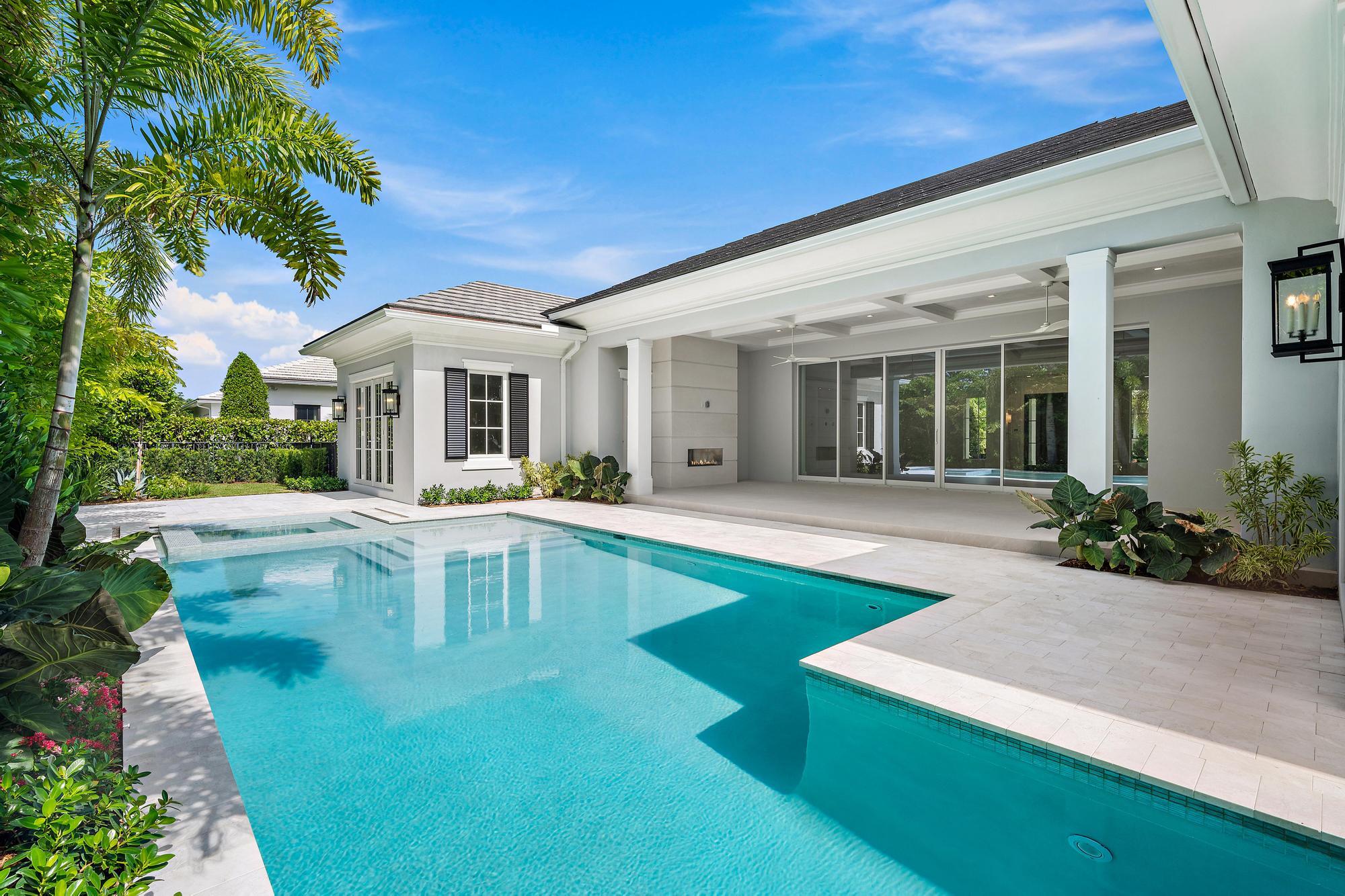 2914 Bluewater Cove Gulf Stream, FL 33483 - Photo 38 of 45 a view of a house with swimming pool and a porch