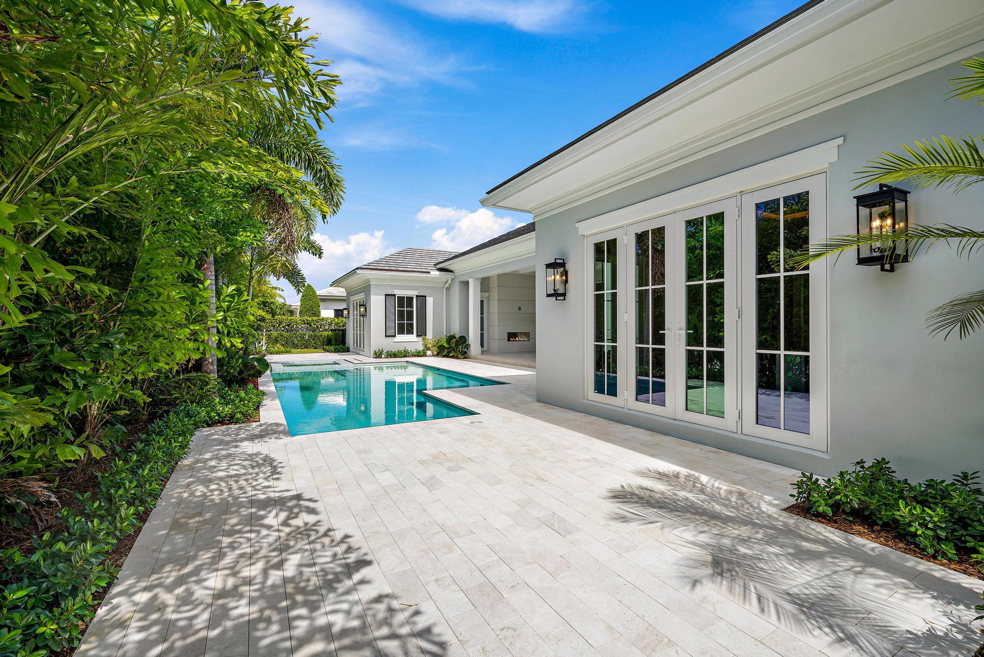 2914 Bluewater Cove Gulf Stream, FL 33483 - Photo 40 of 45 a view of a house with a swimming pool