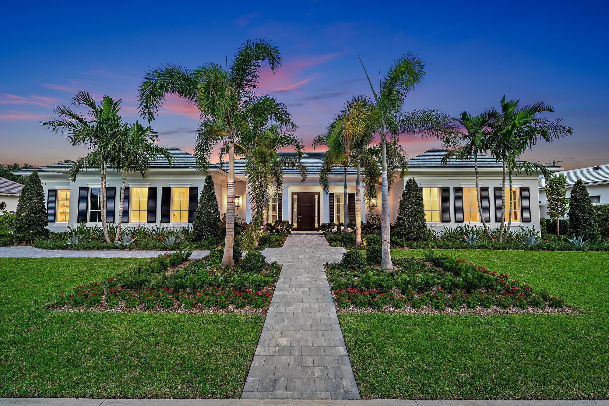 2914 Bluewater Cove Gulf Stream, FL 33483 - Photo 41 of 45 a front view of a house with garden