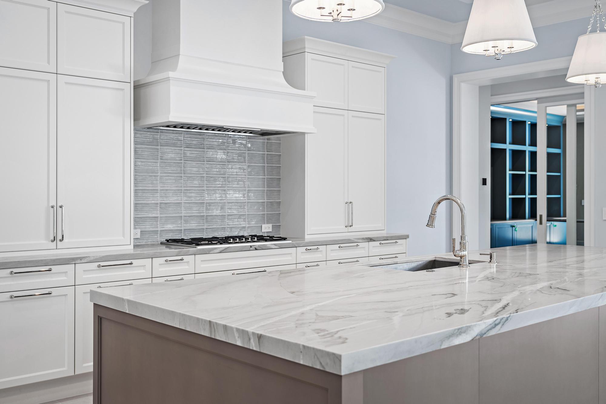 2914 Bluewater Cove Gulf Stream, FL 33483 - Photo 6 of 45 a view of kitchen with granite countertop a sink and a stove