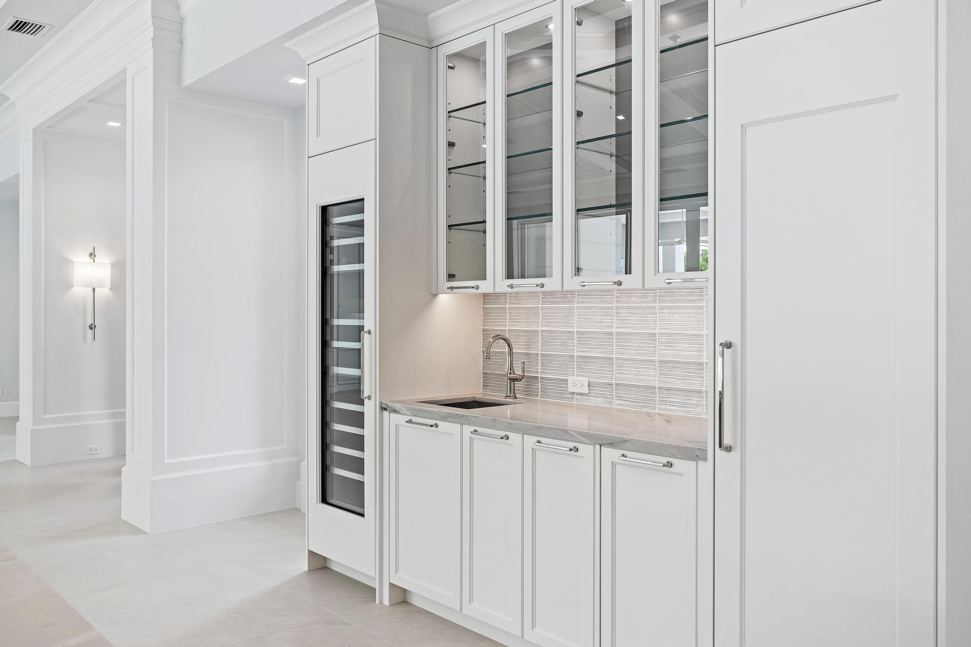 2914 Bluewater Cove Gulf Stream, FL 33483 - Photo 8 of 45 a bathroom with a granite countertop sink and a mirror