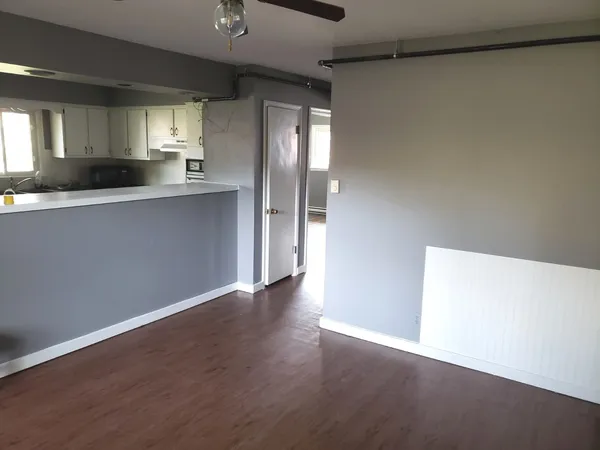 a view of kitchen with wooden floor