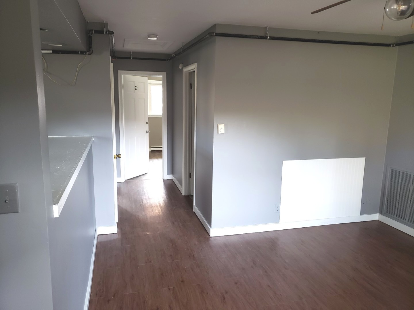 908 Greenbrier Road, Unit 908 DeKalb, IL 60115 - Photo 12 of 14 a view of a hallway with wooden floor