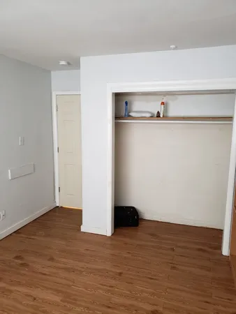 a view of a small space with wooden floor