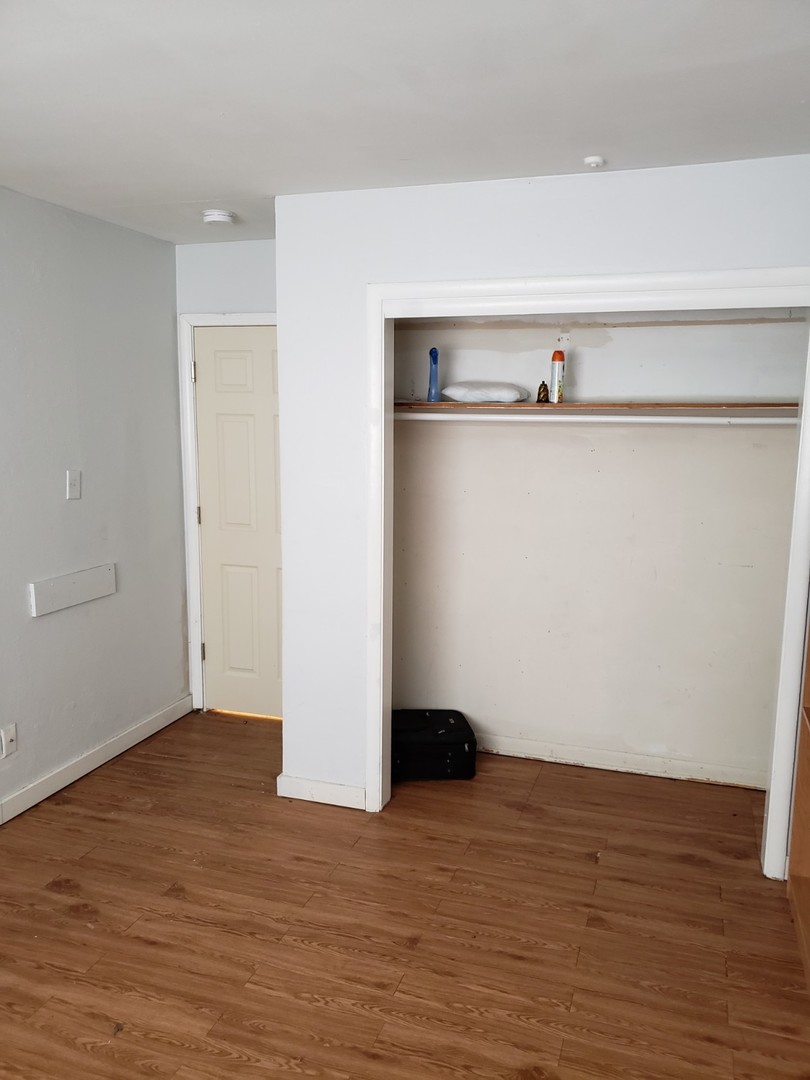908 Greenbrier Road, Unit 908 DeKalb, IL 60115 - Photo 14 of 14 a view of a small space with wooden floor