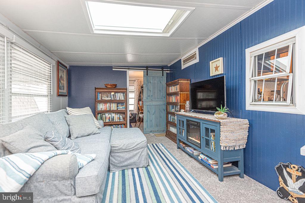 114 Skipjack Circle Berlin, MD 21811 - Photo 17 of 51 a living room with furniture and a flat screen tv