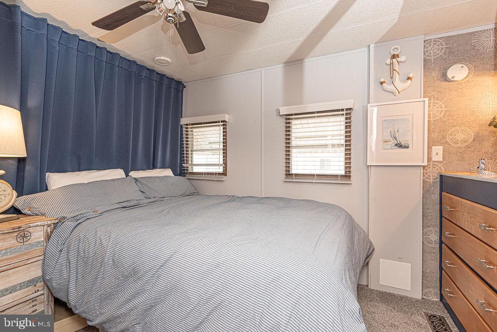 114 Skipjack Circle Berlin, MD 21811 - Photo 39 of 51 a bed sitting in a bedroom next to a window