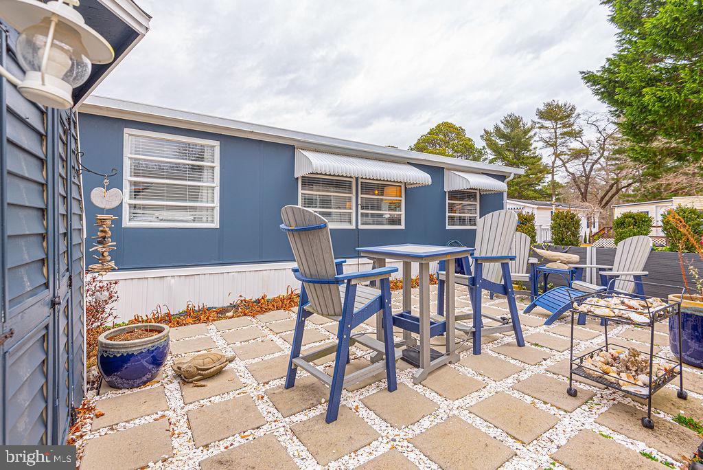 114 Skipjack Circle Berlin, MD 21811 - Photo 6 of 51 a backyard of a house with table and chairs