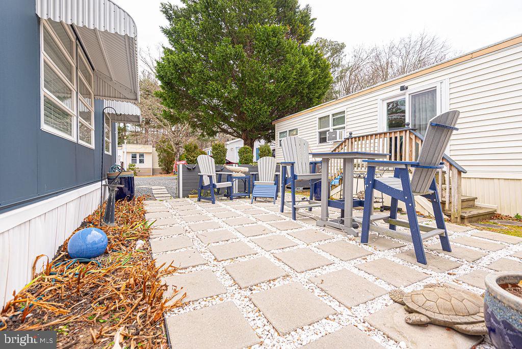 114 Skipjack Circle Berlin, MD 21811 - Photo 7 of 51 a view of a dinning table and chairs in the patio