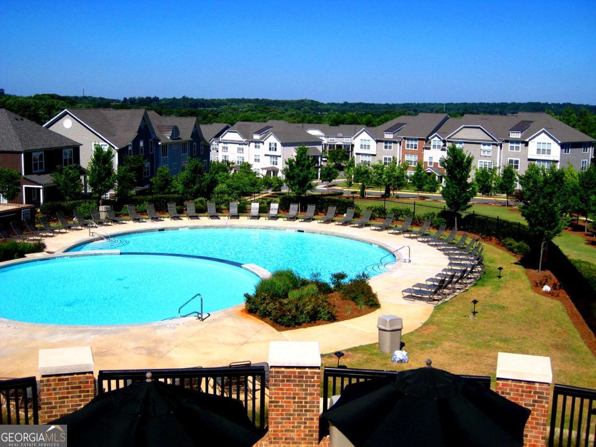1035 South Barnett Shoals Road, Unit 913 Athens, GA 30605 - Photo 13 of 14 a view of swimming pool with outdoor seating and city view