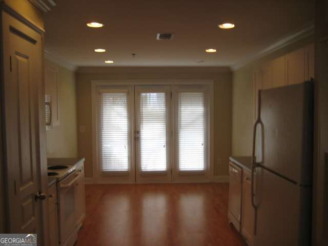 1035 South Barnett Shoals Road, Unit 913 Athens, GA 30605 - Photo 2 of 14 a view of empty room with wooden floor and fan